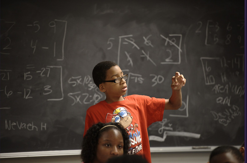 boy looking at fingers image